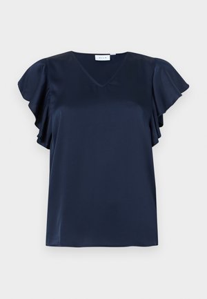 Satenasta modro mornarsko modra bluza z V-izrezom in razgibanimi rokavi, prikazana na svetlo sivi podlagi.