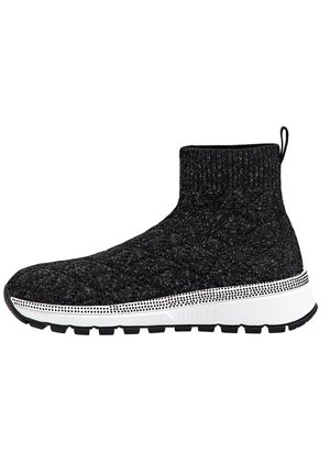 Black knit sock-style sneaker with white speckled midsole and black textured outsole, featuring a pull tab at the ankle.