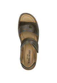 Tmavě zelené sandály se dvěma nastavitelnými popruhy, polstrovanou stélkou a jemnou podobnou semišovou texturou. Obsahují zakřivený design a vyztužené okraje.