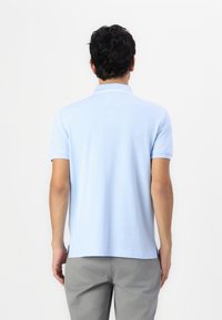 Tommy Hilfiger LEFT CHEST GRAPHIC  - Polo - sweet blue