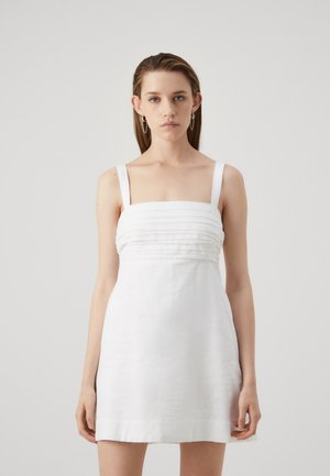 White linen dress featuring a fitted bodice with horizontal pleats, wide straps, and a flared skirt. Smooth texture, minimalist design.