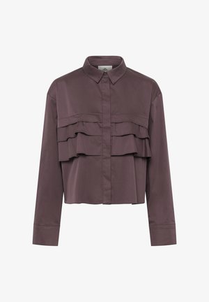 Hosszú ujjú mályvaszínű blúz hegyes gallérral, rejtett gombolós elülső résszel és réteges fodros díszítéssel a mellrészen.