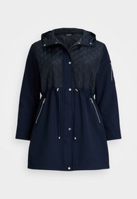 Navy quilted jacket with a hood, featuring zippered side pockets, drawstring waist, and smooth lower fabric. Silver hardware accents.