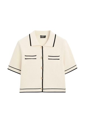 Short-sleeved, cream cardigan with black accents, featuring a collar, two chest pockets, and front buttons. Textured knit material.