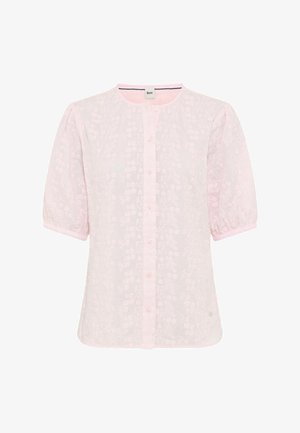 Blouse rose à manches courtes avec encolure ronde, devant boutonné, motif floral subtil et poignets élastiqués.