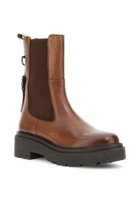 Brun läderankelsko med tjock svart lug-sula, elastiskt sidopanell och bakre dragtab med spänndetalj.