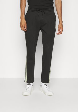 CUT OFF LOGO TAPE PANT - Tracksuit bottoms - black