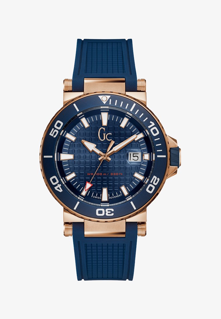 Blaue Silikonarmbanduhr mit einem strukturierten dunkelblauen Zifferblatt, goldfarbenen Akzenten, großen weißen Stundenmarkierungen und einem roten Sekundenzeiger. Wasserdicht bis 100 m.