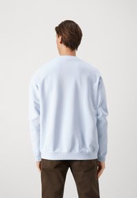 Lacoste Mikina - light blue
