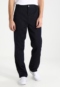 Navyblauwe broek met een rechte pasvorm, gemaakt van katoen, met een sluiting aan de voorkant met een knoop en twee zijzakken.