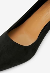 Next Avokkaat - black