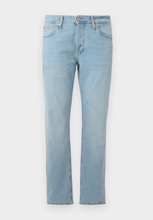 Lyseblå lige jeans lavet af denim, med lynlås, forlommer og diskret slid over stoffet.