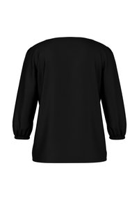 Black long-sleeve blouse with elastic cuffs, shown from the back, featuring a simple, loose fit and no visible embellishments.