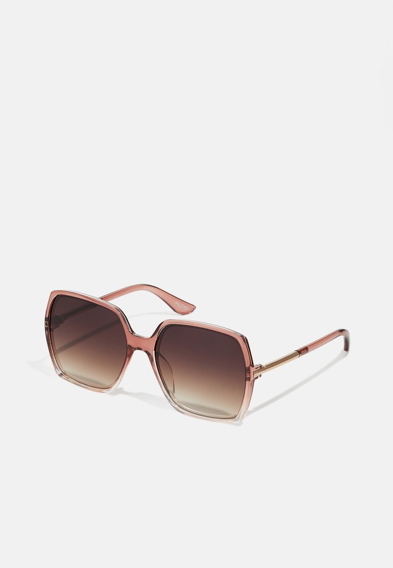 Large square sunglasses with a gradient brown tint. Transparent pink frames feature subtle gold accents on the temples. Stylish, modern design.
