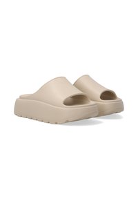 Beige åbne sandaler med tykk sål og glat overdel. Designet har afrundede kanter og brede åbninger for åndbarhed.