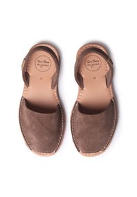 Brown suede sandals with open heel and toe, featuring a natural leather insole, white stitching, and a circular logo on the footbed. Size 37.