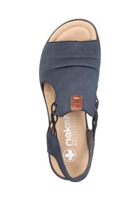 Navy blue open-toed sandal with elastic straps, cushioned insole, and a tan accent piece. Features a smooth texture and lightweight design.