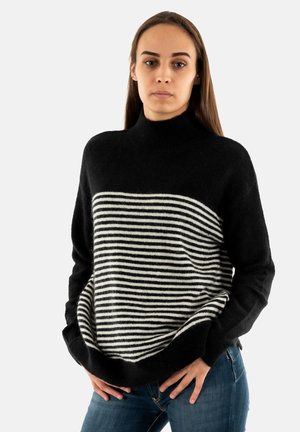 Pull rayé noir et blanc avec un col montant, en mélange de laine, coupe décontractée et manches longues. Texturé avec une finition douce.