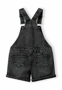 Svart denimjumpers med kort design. Har justerbara remmar, metallklipp och två bakfickor med vikta fållar.