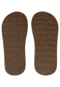 Brune gummisåler med et teksturert zigzag-mønster for grep, med en glatt overflate og avrundede kanter.