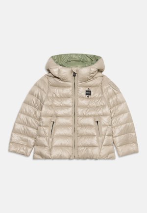 Veste matelassée beige clair avec capuche, fermeture éclair devant, poches latérales zippées et doublure intérieure vert clair contrastante.