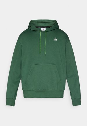 Πράσινο φούτερ με κουκούλα από μαλακό ύφασμα, με τσέπη καγκουρό, κουκούλα με κορδόνια και μικρό λευκό λογότυπο στο στήθος.