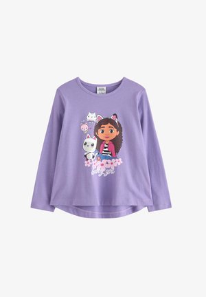 Lilac long-sleeve shirt featuring a cartoon girl with brown curly hair, surrounded by cute animals and flowers, with the text "Gabby girl."