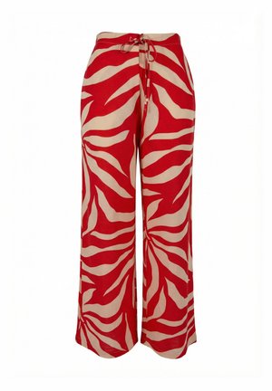 Weit geschnittene Hose mit einem roten und beigen Zebramuster und einem Bindeband in der Taille.