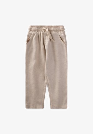 Beige elastsete püksid, millel on tõmbluku string ja kaks küljetaskut, pehme ja tekstuurse kangaga, millel on õrn muster.