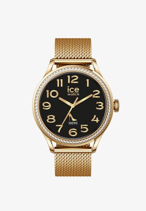 Polshorloge met gouden metalen horlogeband, zwarte wijzerplaat, gouden Arabische cijfers, kristallen lunette en logo met een hakje-icoon op de positie van zeven uur.