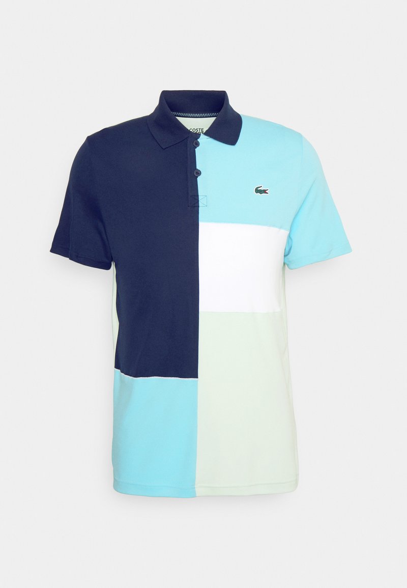 Polo en color-block présentant des panneaux bleu marine, bleu clair, blanc et vert menthe. Fabriqué en coton doux avec un col.