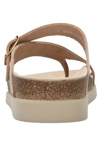 Sandales beige avec doubles sangles et semelle en liège texturée. Elles présentent une boucle en ton doré et une semelle intérieure rembourrée pour le confort.