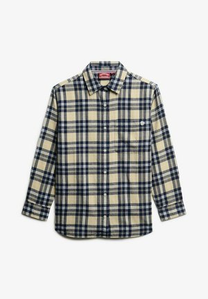 Chemise à manches longues à carreaux beige et bleu marine, fabriquée en tissu flanelle. Présente une fermeture par bouton et une poche poitrine, avec un logo sur la poche.
