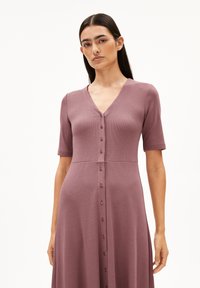 Button-up dress in dusty mauve ribbed fabric, with short sleeves and a V-neckline; features buttons down the front and a fitted waist.
