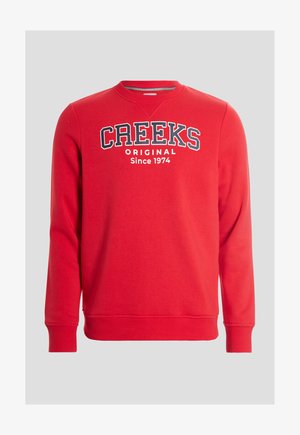 Rode katoenen sweatshirt met een ronde hals, met de tekst "CREEKS ORIGINAL Sinds 1974" in wit en marineblauw, en ribgebreide mouwen en zoom.