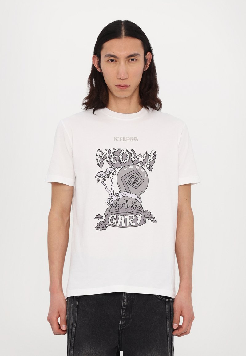 Hvid bomulds t-shirt med et grafisk print af en stiliseret snegl og teksten "MEOW! GARY" i fed, kontrasterende sort og grå farver.