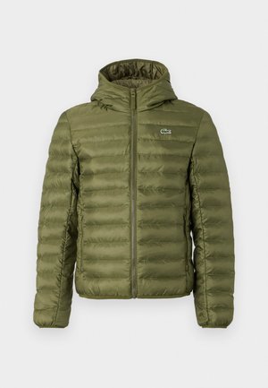 Olive green padded jacket with a zip front, hood, and horizontal quilted texture. Features a small logo on the left chest and elastic cuffs.