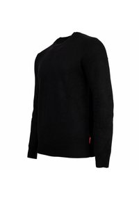 Zwart langemouw crewneck trui met geribbelde manchetten en zoom, weergegeven op een mannequin torso tegen een witte achtergrond.