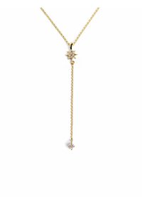 Collier en or avec un pendentif en forme d'étoile orné d'un petit cristal, relié par une chaîne fine, avec un design à suspension longue.