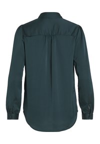 Blouse vert foncé à manches longues, avec col et poignets boutonnés, vue de dos, avec un tissu froncé sous l'empiècement.