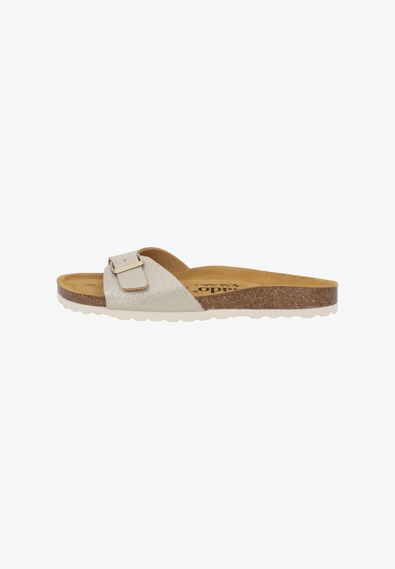 Slide sandal with a glittery silver upper, cork footbed, and white rubber sole. Features a wide strap with a rectangular buckle detail.