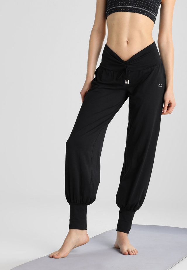 UMA - Tracksuit bottoms - black