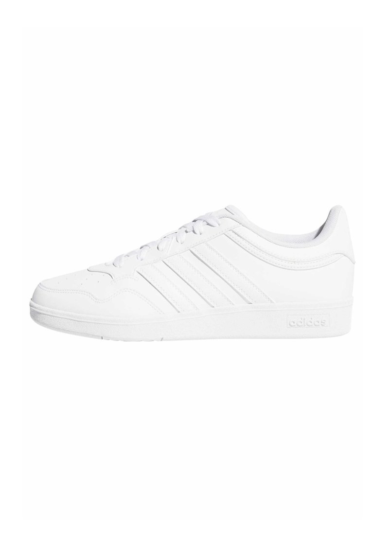 White athletic shoe with a smooth leather-like upper, featuring three narrow stripes and a textured sole for grip.