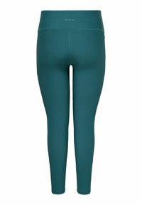 Leggings bleu sarcelle fabriqués dans un matériau extensible et lisse. Dotés d'une taille haute et d'une silhouette ajustée. Aucune motif ou accent visible.