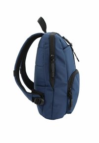 Zaino blu navy con design imbottito, molteplici tasche con zip, spallacci regolabili e una maniglia superiore per una facile portabilità.