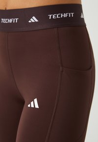 adidas Performance STASH - Legíny - kalhoty  - shadow brown