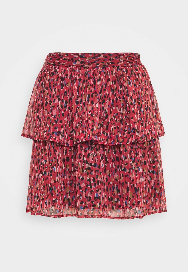 Jupe rouge à volants avec un motif léopard rose, noir, bleu et marron sur fond clair.