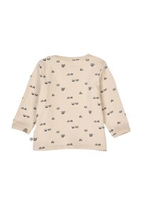 Beige long-sleeve shirt with an all-over pattern of cars and faces in gray and yellow. Soft cotton fabric with a round neckline.