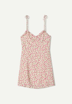Floral slip dress with a cream background, adorned with small pink roses. Features narrow adjustable straps and a fitted bodice.