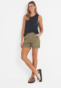Dark blue sleeveless top, olive green shorts, and brown sandals. Fabric is smooth; shorts feature rolled cuffs and multiple pockets.
